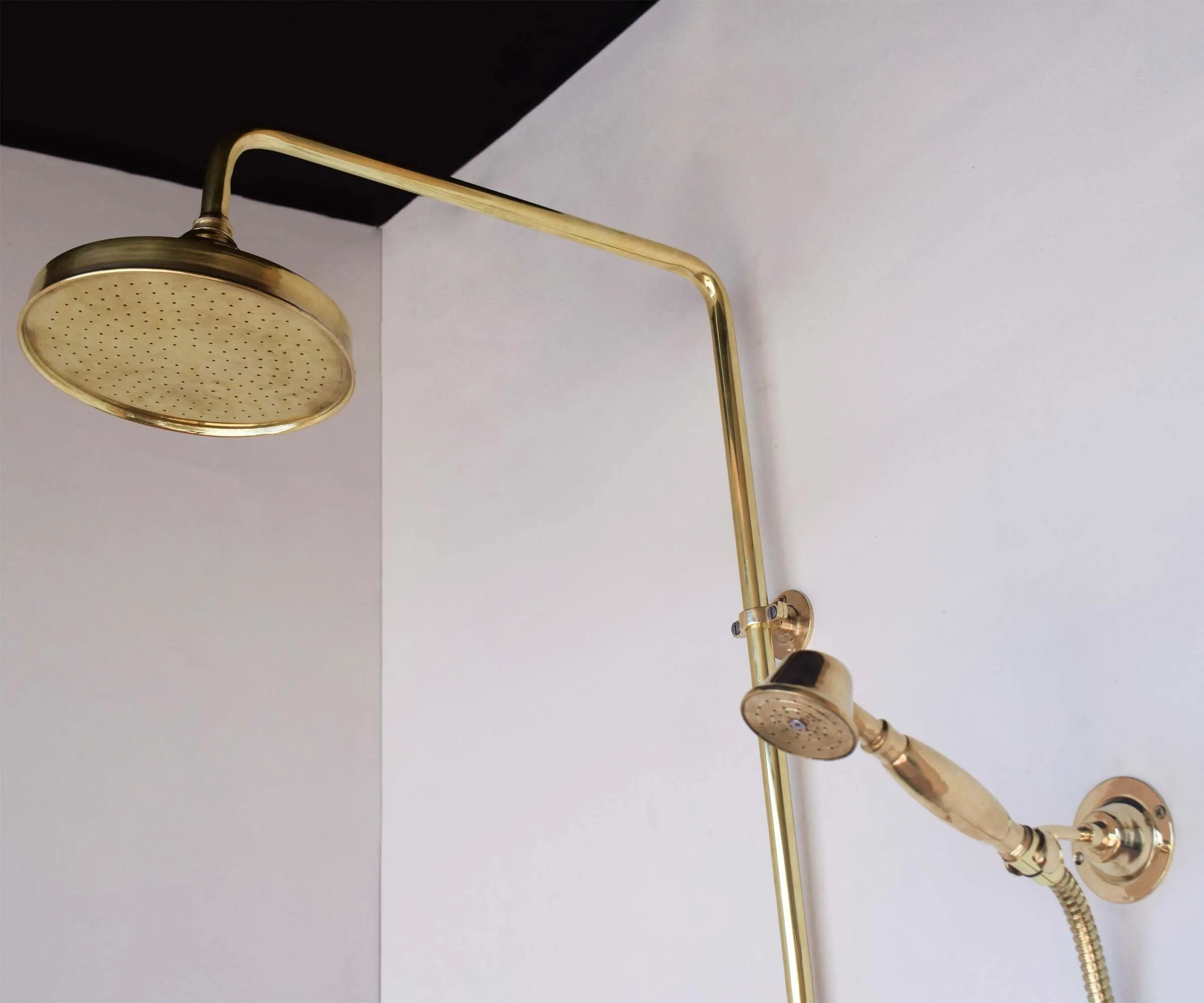 Unlacquered brass exposed shower system